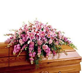 Loving Farewell Loving Farewell - This majestic casket cover is done in shades of pinks and lavender. Arranged with stock, stargazer lillies, poms and other flowers