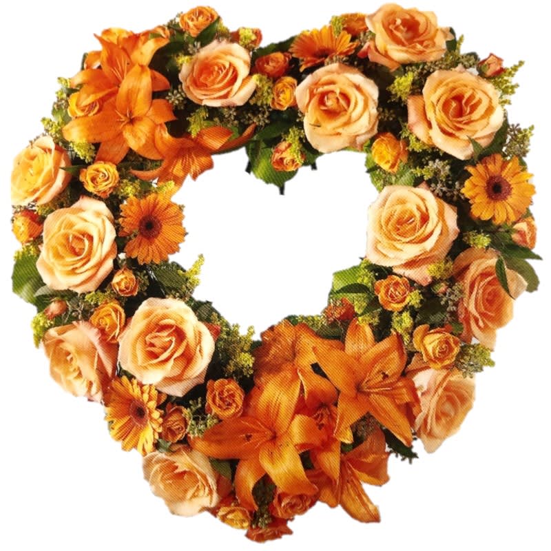 The Hearts Eternal Wreath The Hearts Eternal Wreath - This beautiful heart-shaped wreath holds all the colors of the sunset. Orange roses, golden spray roses, orange la lilies and orange mini Gerbera daises are accented with yellow solidago and seeded eucalyptus. All product dependent on availability.