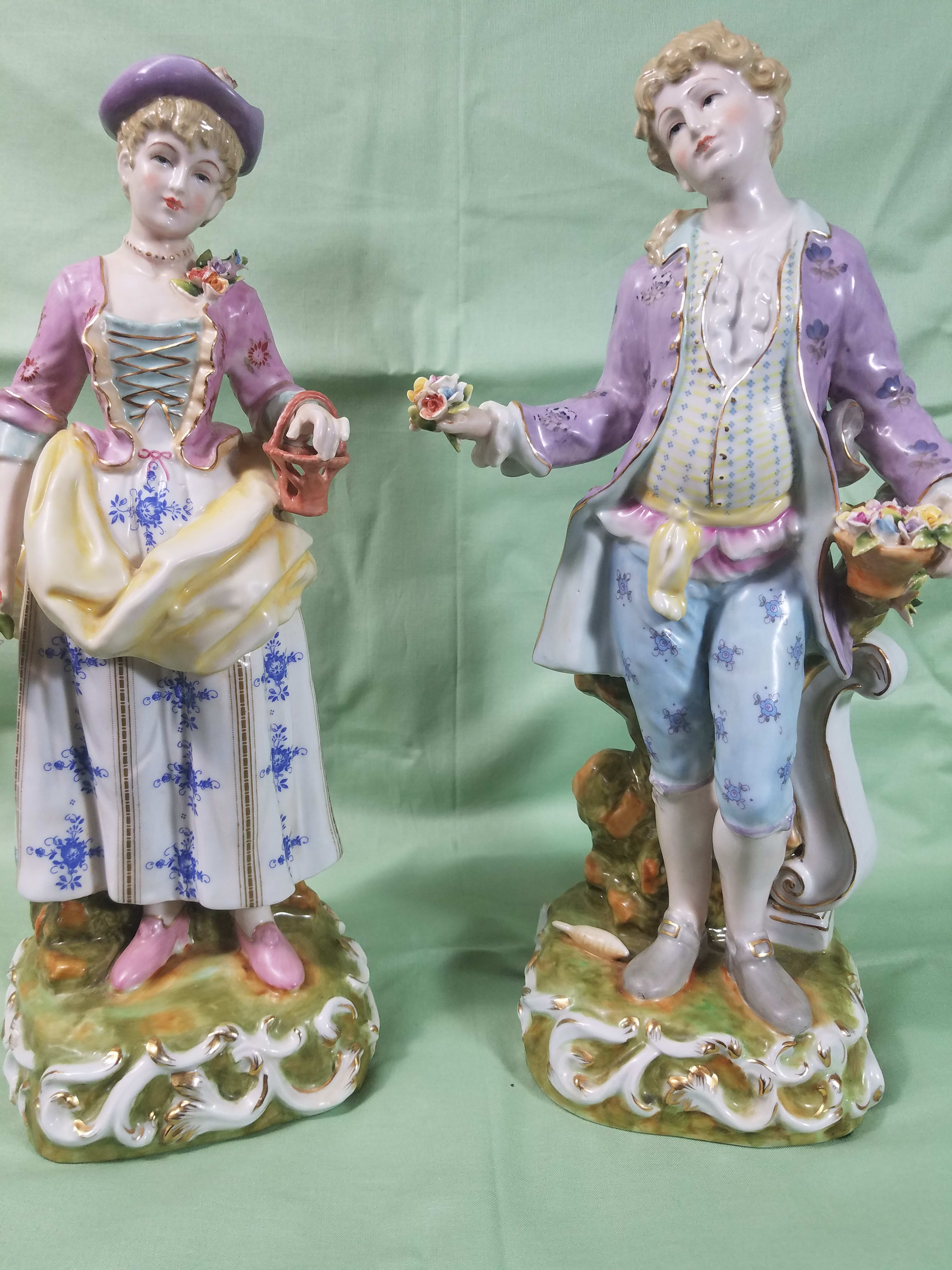     ANTIQUE  PORCELAIN  FIGURINES   NEW-G88 - This pair of fine quality ANTIQUE PORCELAIN FIGURINES were made by Volkstedt / Greiner and Holzapfel  of Volkstedt, Thuringia, Germany from 1804 - 1815   This exceptional pair of figurines are of the highest quality and has no chips or cracks and is in excellent condition.. They stand an impressive 14 inches tall and are a true antiques collectors dream.. The fourth pic. shows the bottom and the mark of the maker Volkstedt/Greiner and Holzapfel.  More  and better pictures showing greater detail will be added here soon.. For more information or questions about shipment here in the U.S.A.  please phone us at 1-800-331-5358