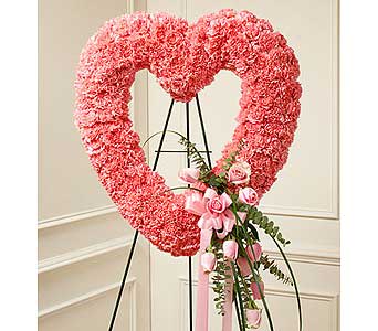 Pink Open Heart Pink Open Heart - This open heart standing spray crafted of soft pink roses and carnations, accented by bear grass is the perfect choice to convey your sympathy and love. As Shown : HUD-91240