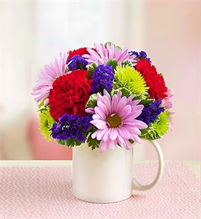 I Love You Mugable - Product ID: 95458  EXCLUSIVE For the one who captured your heart, return the favor with a gift that's sure to touch theirs. It starts with our truly original Mugableâ¢ arrangement of gorgeous bright carnations, poms and more. Step it up with a foam heart pick, &quot;I Love You&quot; balloon and sweet candy for your sweetheart. Make a lasting impression by adding a cuddly plush bear. â¢ Vibrant, rounded bouquet of red carnations, lavender and green poms, purple statice and variegated pittosporum â¢ Gathered by our expert florists in a reusable, food-safe 4.5&quot;H handled mug; mug may vary based on local availability (Shown) â¢ Medium gift comes with a mini &quot;I (Heart) You&quot; foam floral pick, a romantic Mylar balloon, and a 4 oz bag of assorted candy â¢ Large gift comes with all of the above plus a 10&quot;L plush brown bear; plush is safe for ages 3 and up â¢ Mugableâ¢ arrangement measures approximately 7&quot;H x 6&quot;L â¢ Our florists select the freshes