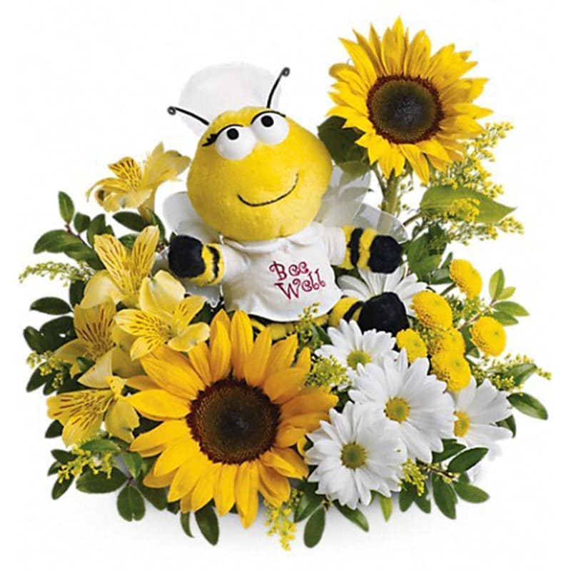 Teleflora's Bee Well Bouquet - We have just the cure for what ails them. A plush nurse bee is ready to buzz into service with enough fresh flowers to make anyone perk up.  A plush bumble bee surrounded by sunny yellow sunflowers, yellow button chrysanthemums, alstroemeria and white daisies.      Orientation: One-Sided      All prices in USD ($)      Standard      T01J400A      Deluxe      T01J400B      Premium      T01J400C 