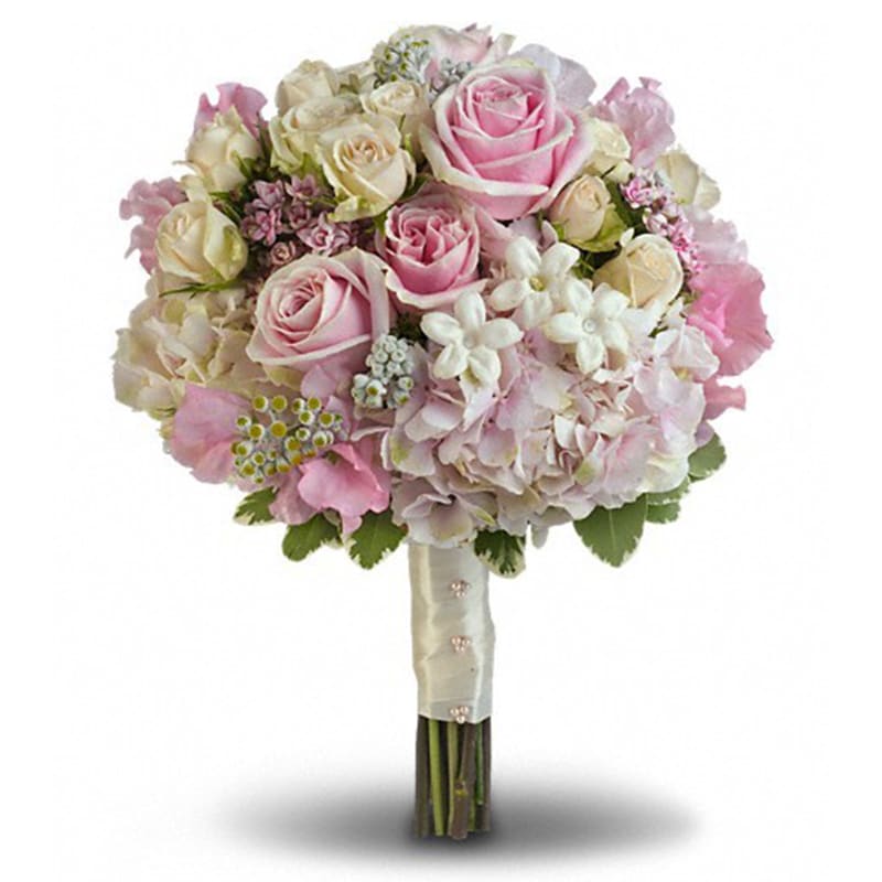  Pink Rose Splendor Bouquet - A wonderfully wide variety of soft pink and white blooms make this fragrant bouquet fabulously feminine.  Sensational stems of pink hydrangea, light pink roses, crème roses, pink sweet pea, pink bouvardia, stephanotis and dusty miller are contrasted against variegated pittosporum.      Orientation: N/A      All prices in USD ($)      Standard      T190-1A 