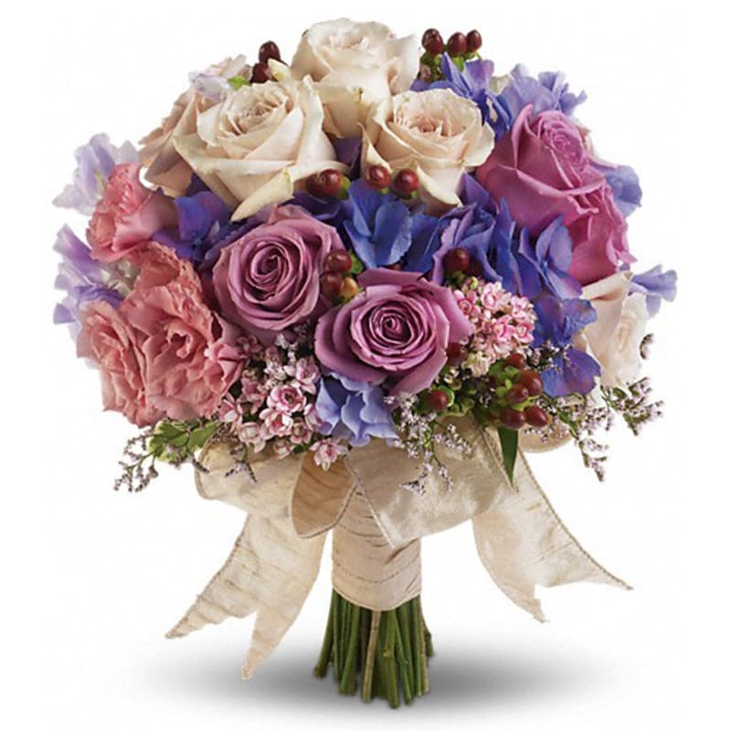  Country Rose Bouquet - Dusty lavenders, soft mauves and creamy whites create a charming, country-inspired bouquet.  Pink bouvardia, lavender hydrangea, lavender and crème roses, pink limonium, pink lisianthus and lavender sweet pea with red hypericum.      Orientation: N/A      All prices in USD ($)      Standard      T194-4A 
