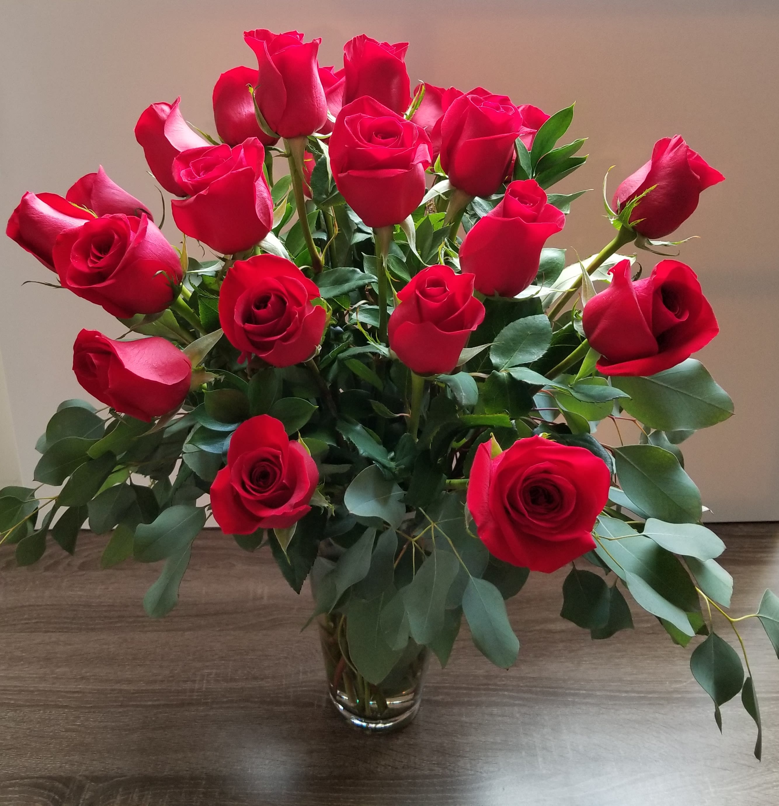 24 Red Roses in a French Vase - 24 Gorgeous long stem roses in a beautiful tall French vase, mixed with eucalyptus leaves.   