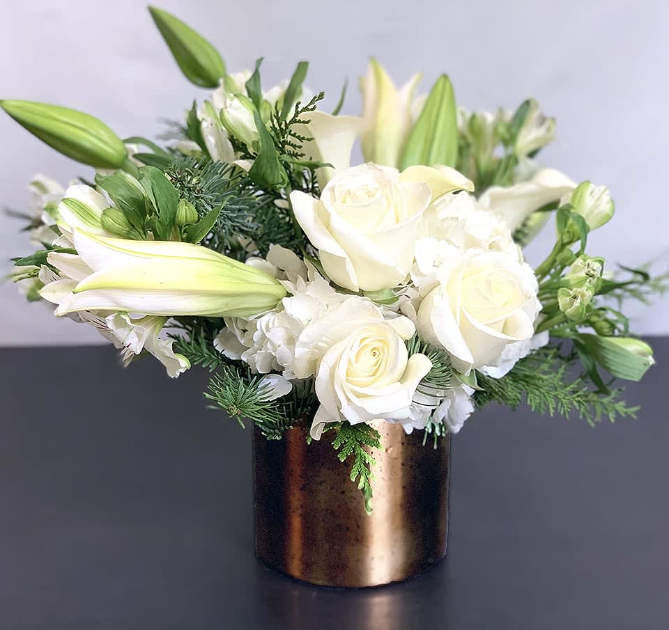 Celebration ADH20-4 - Help celebrate the holiday season with this incredible arrangement of Hydrangea, calla lilies, roses and other premium flowers. Available in three sizes. Holiday greens can be substituted. Please request in special instructions. Approx Size: 10&quot; x 10&quot; 