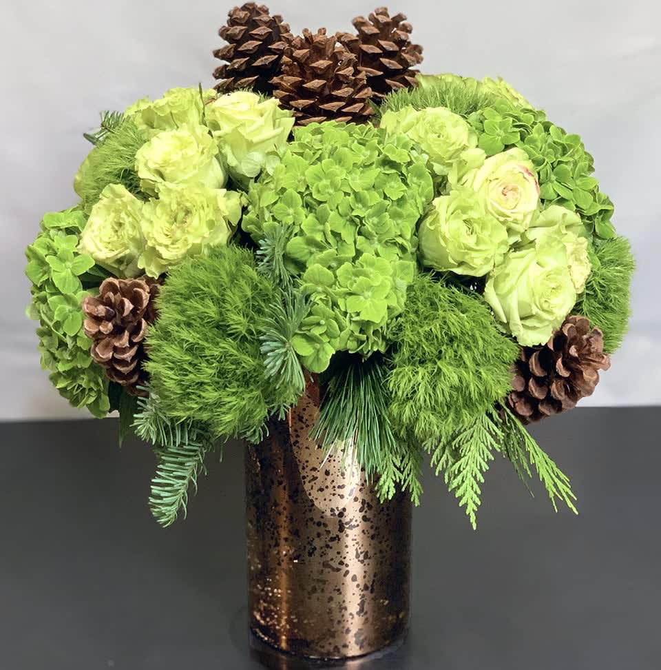 Winter Forest - Premium ADH20-9 - The beauty of a winter forest in an arrangement of Hydrangea, Roses, Pinecones and other premium flowers. Premium Size. Available in three sizes. Winter greens can be substituted. Please request in special instructions. Approx Size: 18&quot; x 15&quot;