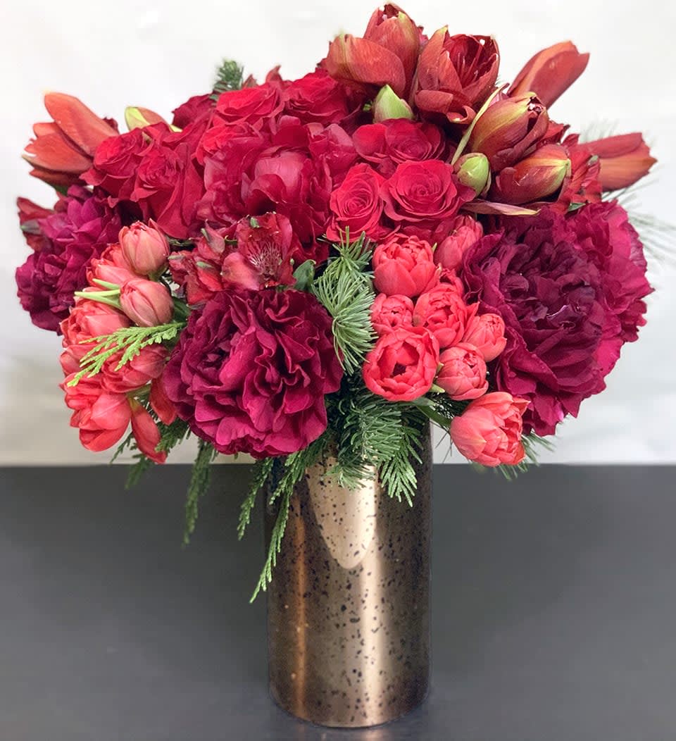 Holiday Magic - Premium ADH20-3 - The magic of the holidays in a gorgeous tone on tone floral arrangement of Peonies, Tulips, Roses, and other premium flowers and greens. Premium Version. This is the best of the best. Available in three sizes. Substitution of greens is available. Please note that in special instructions. Approx Size: 18&quot; x 15&quot;
