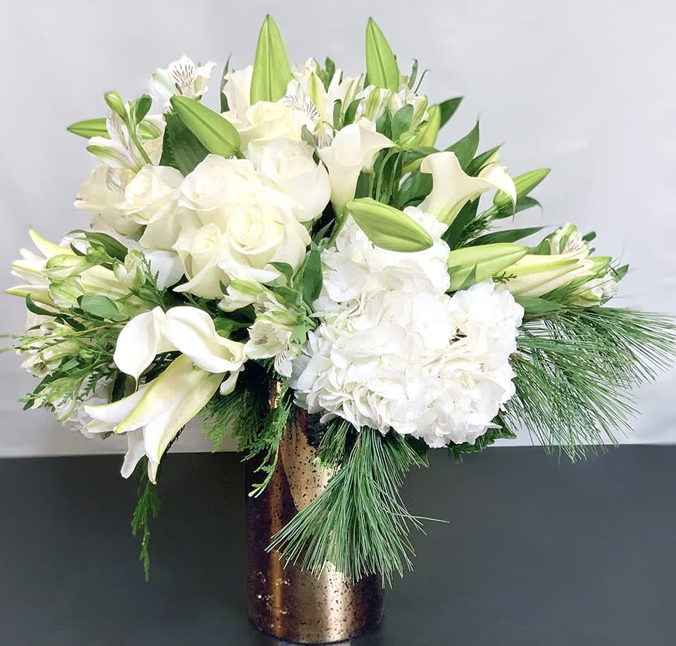 Celebration - Premium ADH20-6 - Help celebrate the holiday season with this incredible arrangement of Hydrangea, calla lilies, roses and other premium flowers. Premium version. Available in three sizes. Holiday greens can be substituted. Please request in special instructions. Approx Size: 18&quot; x 15&quot; 