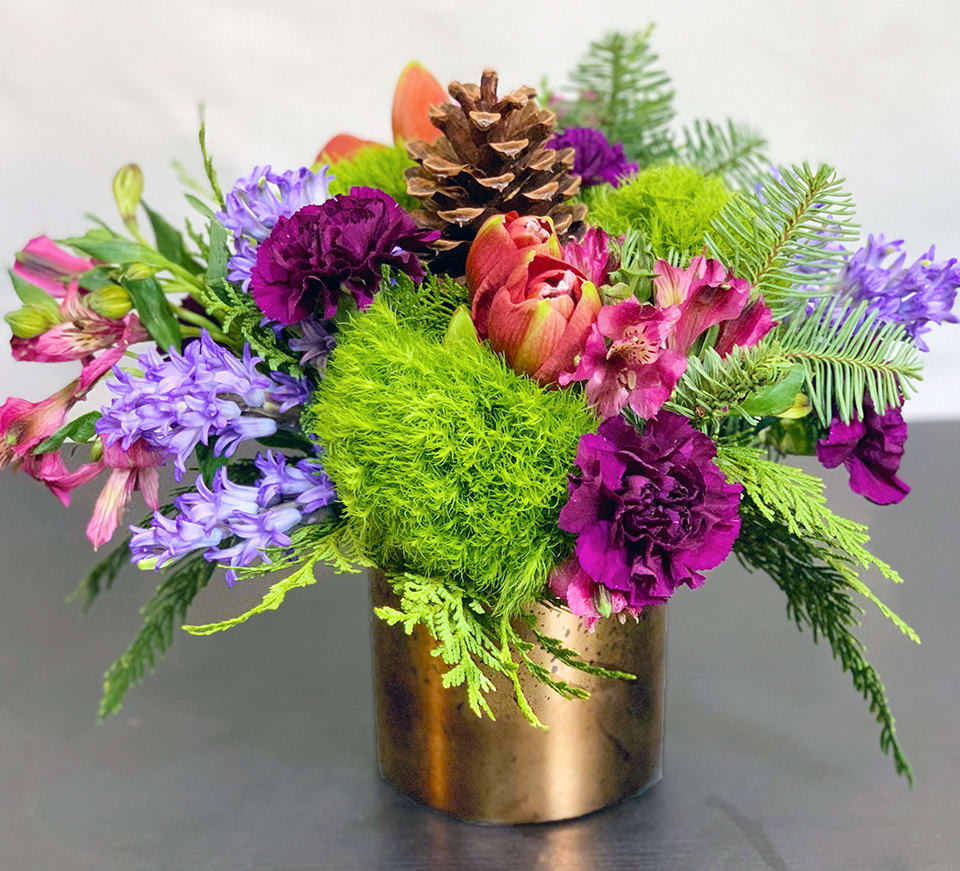 Holiday Jewels ADH20-10 - A jewel like arrangement for the most precious jewels in your life. An incredible mix of Hyacinth, Amaryllis, and other premium flowers and greens. Available in three sizes. Holiday greens can be substituted. Request substitution of greens in special instructions. Approx Size: 10&quot; x 10&quot;