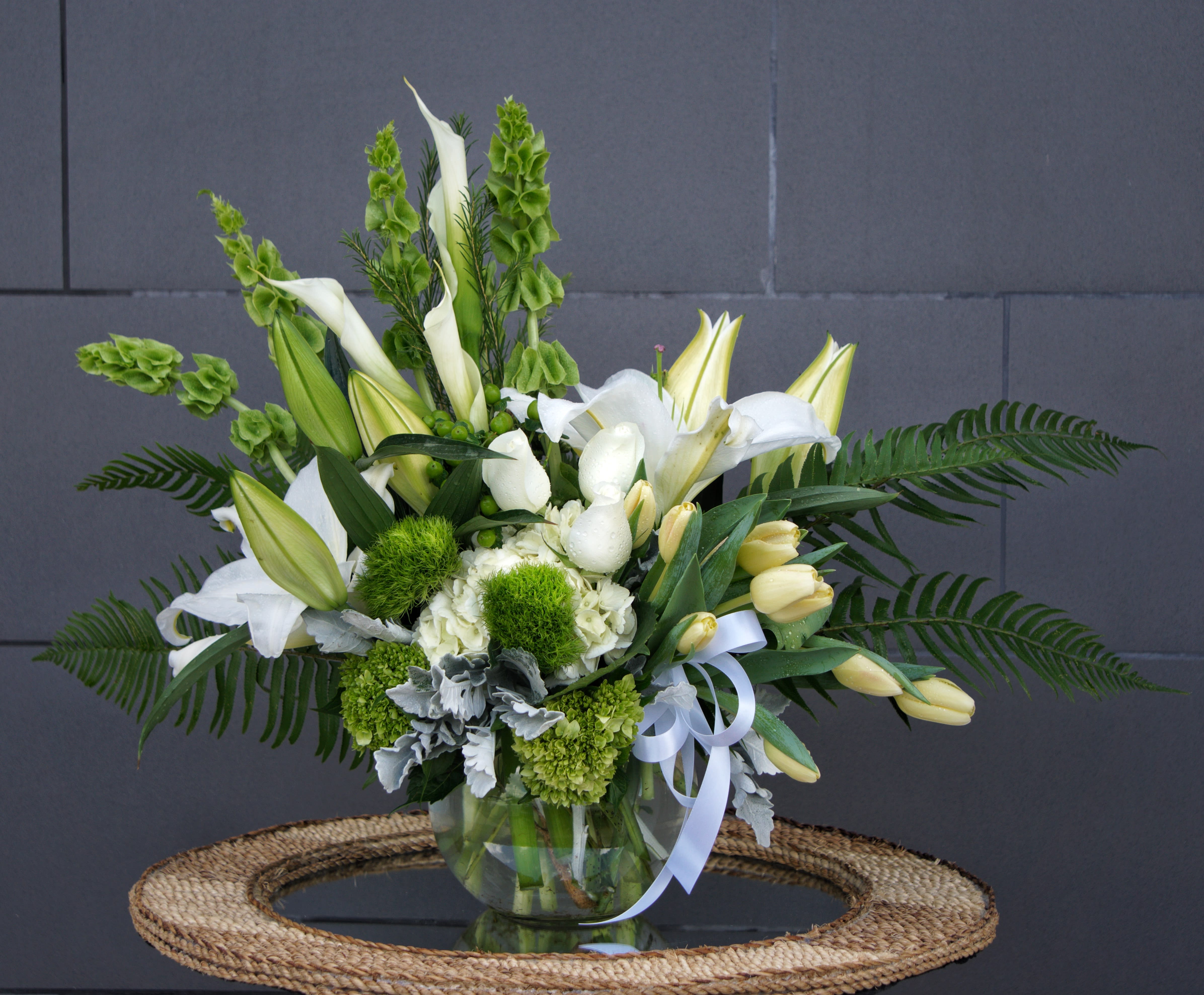 Green Hope - Nature style including all premium fresh flowers: Bells of Ireland, lily, rose, hydrangea... and nice accents.