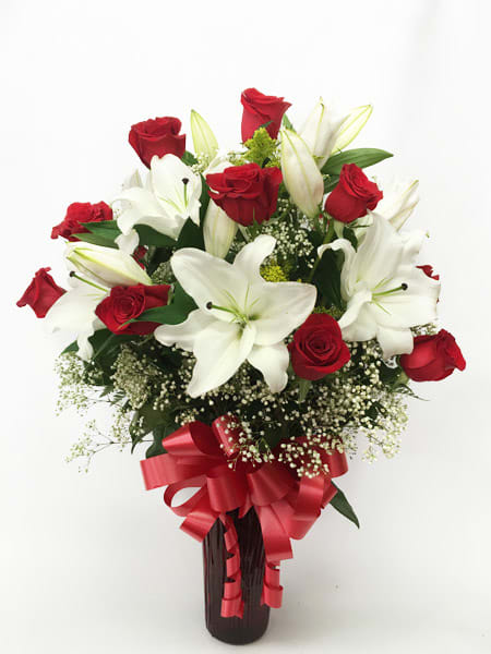 All things grow with love - Send this beautiful arrangement of roses and lilies to that special person