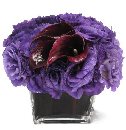 Purple Delight - Lisianthus and Mini Calla Lilies in a leaf lined vase.
