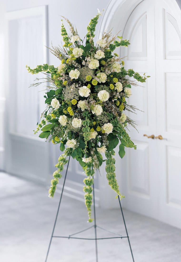 Splendor Standing Spray Splendor Standing Spray - The Splendor Standing Spray combines various shades of green with a natural assortment of foliage on an easel.