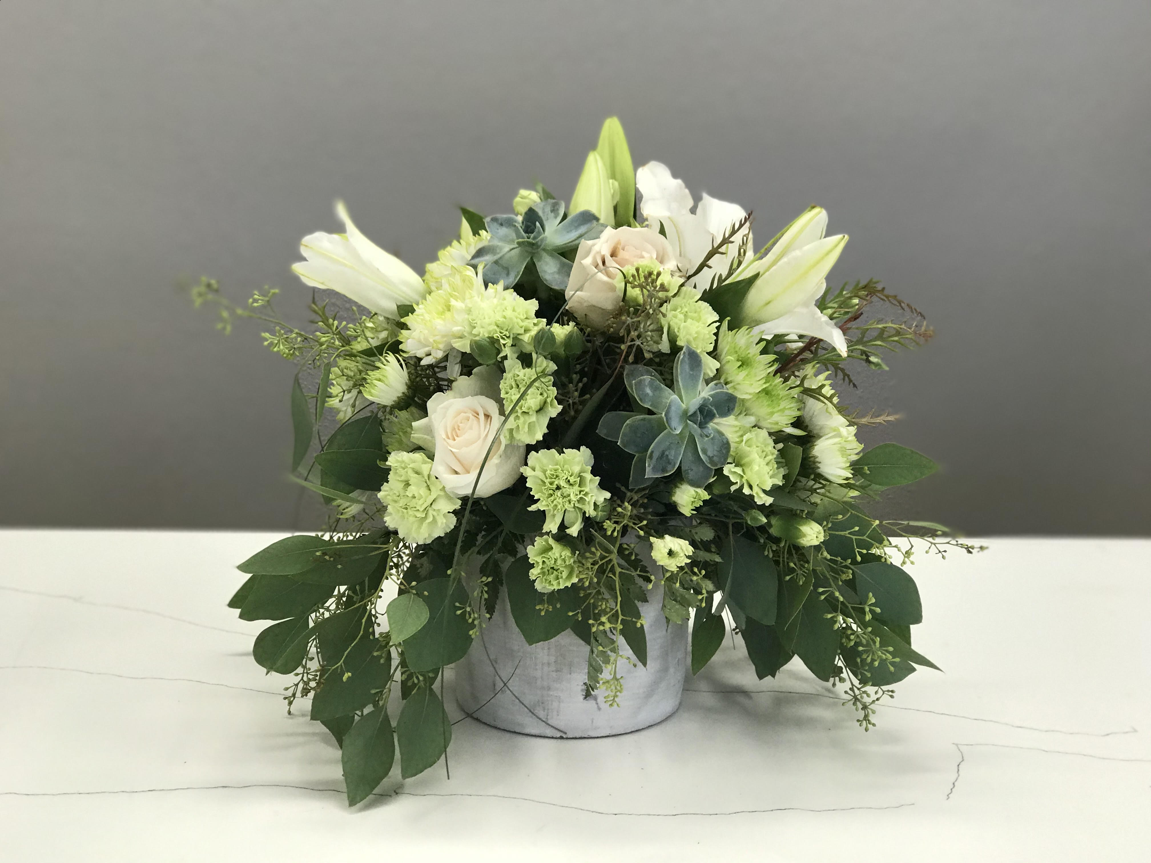 Desert Rose Desert Rose - Hues of cream and sage with burst of white and pear creating an elegant earth feel, bringing calm and loveliness to cherished friends or family.