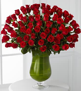 Attraction Luxury Rose Bouquet - 48 Premium Long-Stemmed Roses - Love is in the air and pounding in your heart. Bind your hearts as one with an overwhelming and dazzling display of our 24-inch premium long-stemmed rich red roses situated in a highly elegant clear glass pedestal vase. This timeless display of beauty extends the traditions of ages past to link your hearts to the future.  Includes 72 stems of 24-inch premium long-stemmed red roses, exotic foliage and a superior 16-inch clear glass pedestal vase. Approx. 33H x 26W