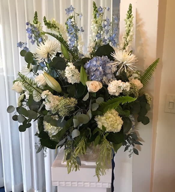 Sympathy and love... - Podium display Can be made in any shades. Appropriate for sympathy, church, corporate events, stage pieces Premium floral , hydrangea, roses, eucalpytus,snalps, dalphinium and other elegant floral