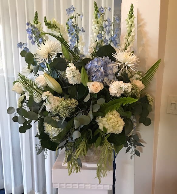 Sympathy and love... Sympathy and love... - Podium display Can be made in any shades. Appropriate for sympathy, church, corporate events, stage pieces Premium floral , hydrangea, roses, eucalpytus,snalps, dalphinium and other elegant floral