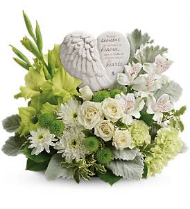 Hearts In Heaven Bouquet Hearts In Heaven Bouquet - A heartfelt expression of your sympathy, this majestic mix of white roses will rejuvenate the spirit. Nestled among the blooms is a graceful angel's wing keepsake, etched with an encouraging message they'll cherish forever. Message on sculpt reads: "Because someone we love is in heaven, there is a little bit of heaven in our hearts."