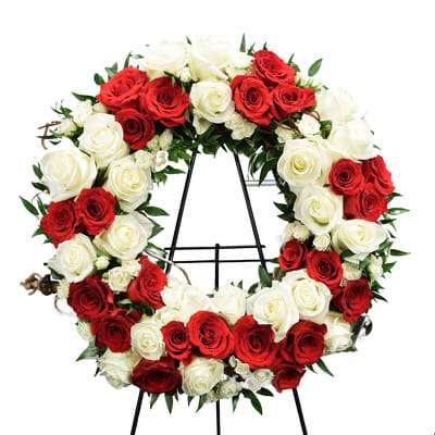 Peace and Courage Heart  -  Peace &amp; Courage Sympathy Wreath with red Roses, white Roses, white Spray Roses and Italian Ruscus.