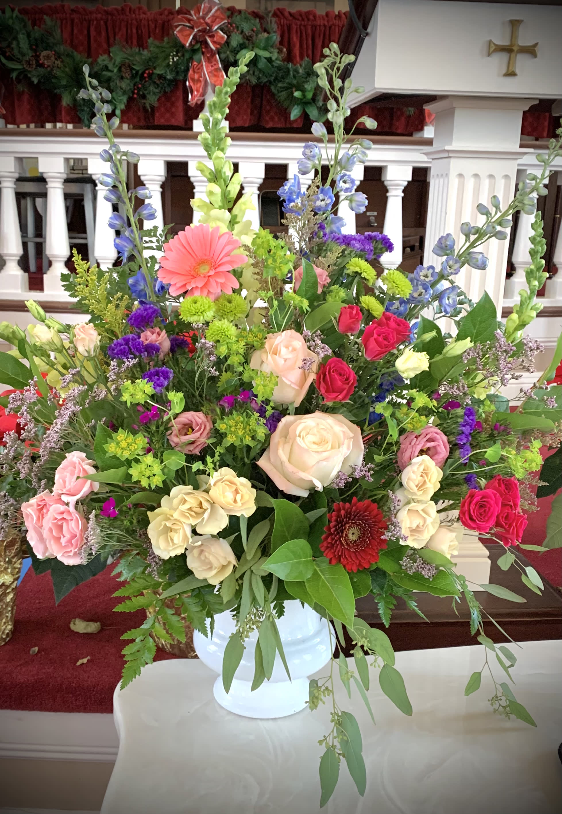 Angelique Angelique - A garden style blend of roses and wildflowers are a cheerfully comforting addition to the service.