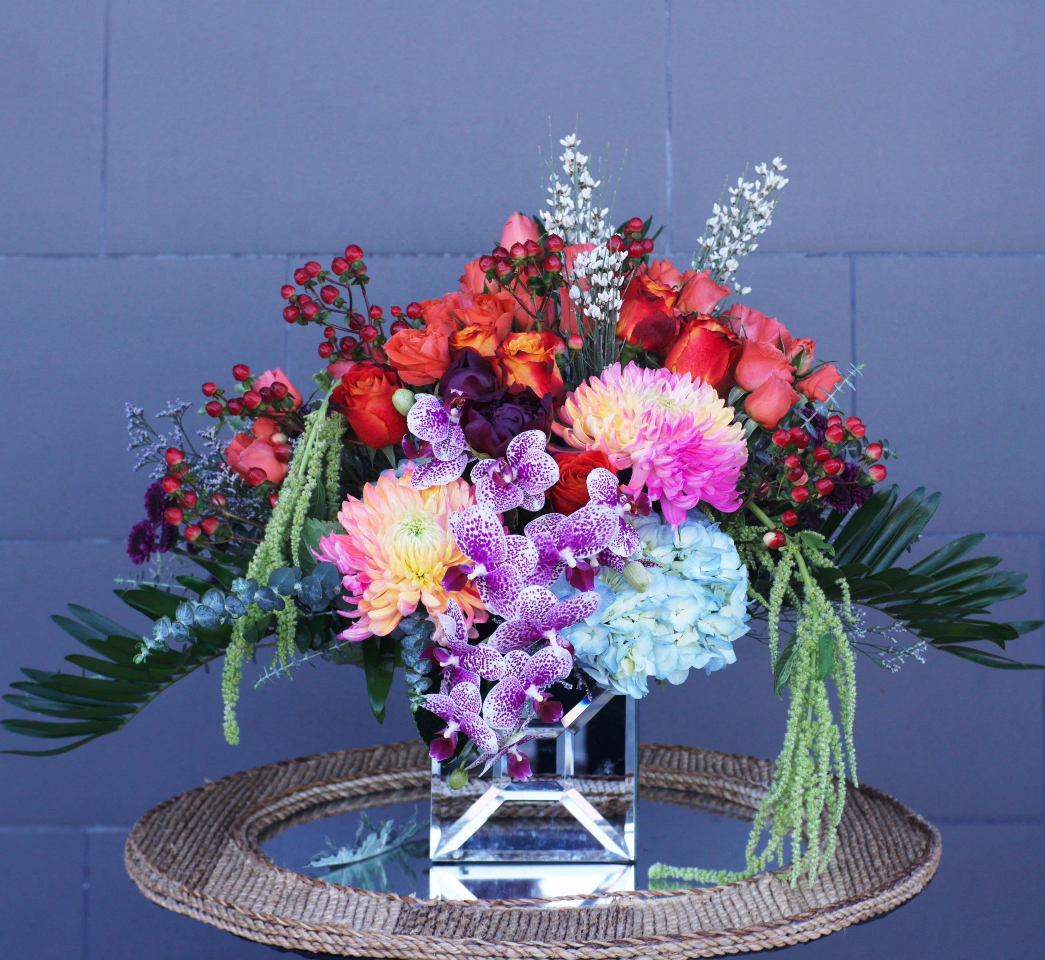 Sunset Beauty - Beautiful design including all premium flowers: orchid, hydrangea, rose... and accents in a nice vase. Dimensions: 17&quot; H x 20&quot; L