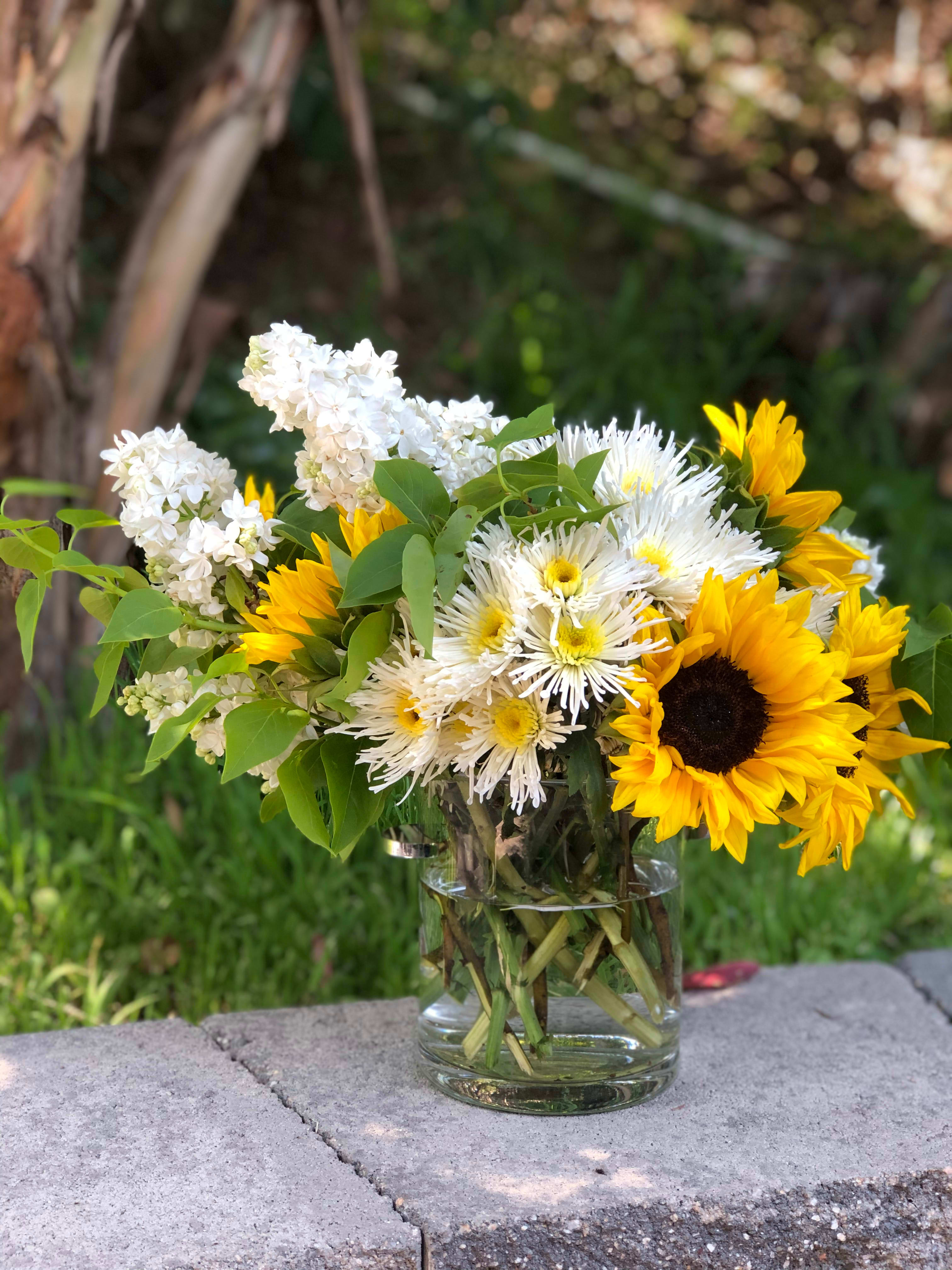 Sunflowers and daisies top