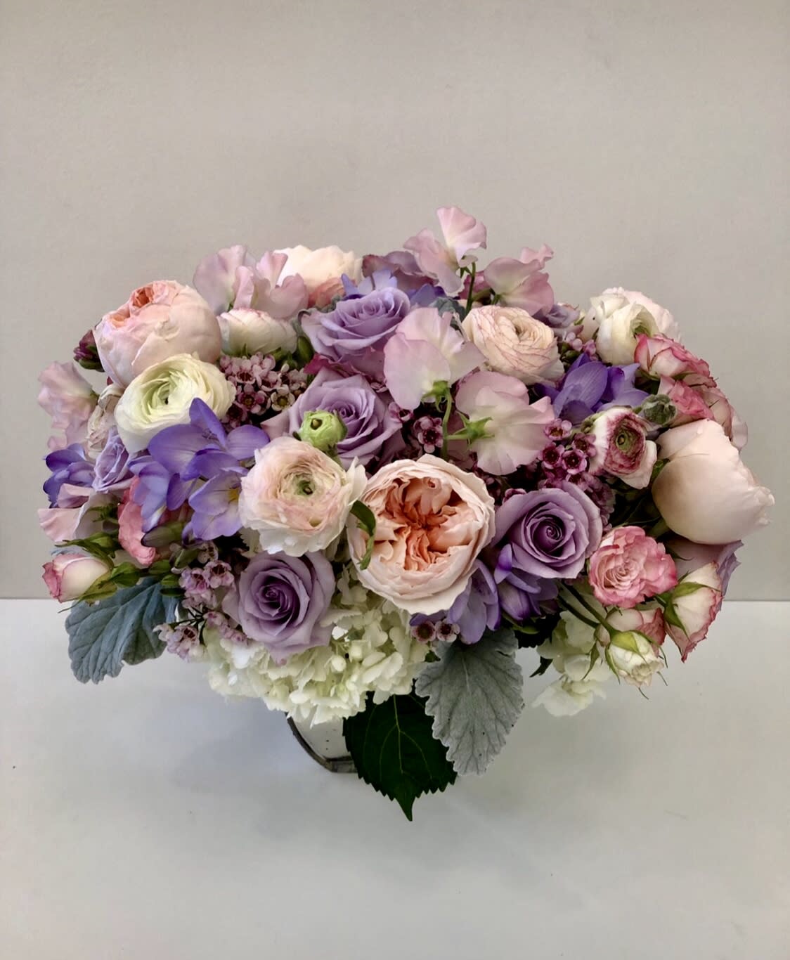 Veranda - assorted beautiful garden blooms in mercury glass vase