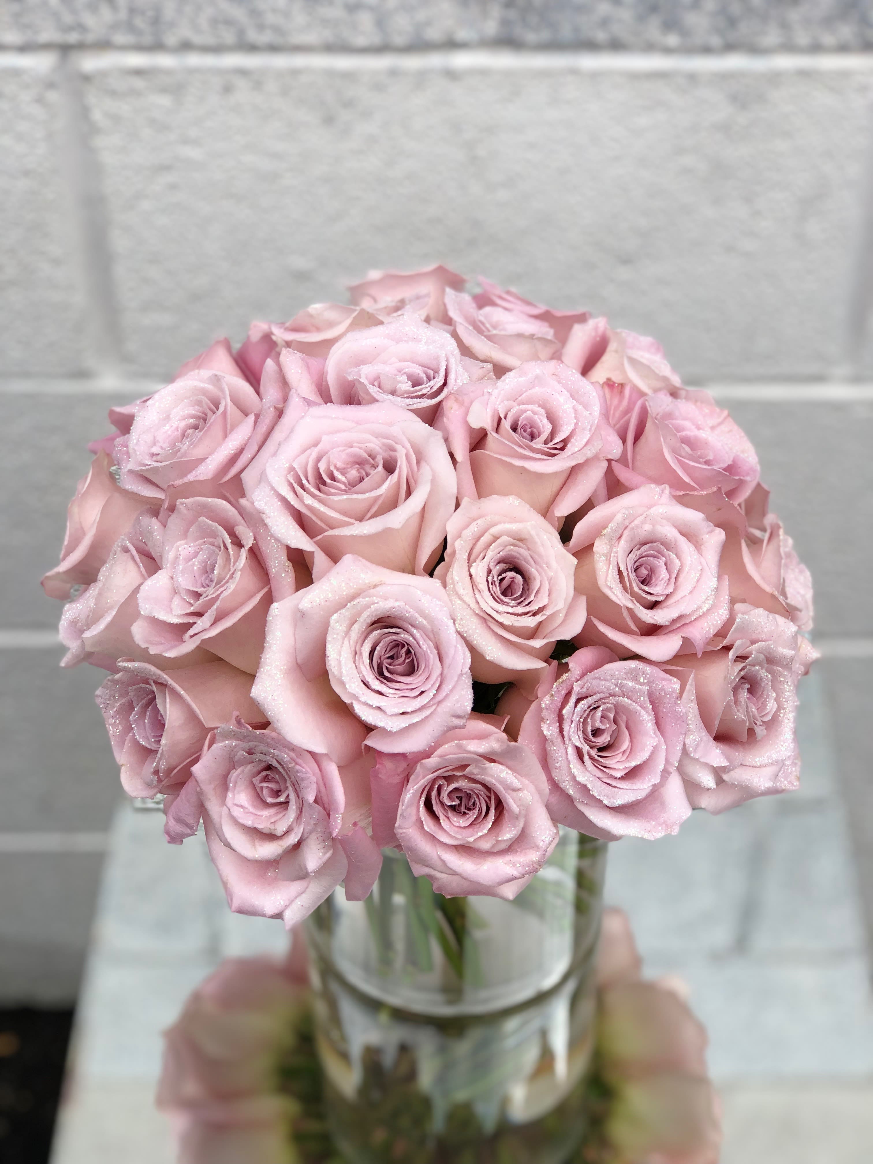 Blushing GlitterRoses Blushing GlitterRoses - A low and lush sparkly pink arrangement made up of blush pink glittered roses is the perfect gift for a pink lover! Pink roses vary from different shades available from our shop daily.