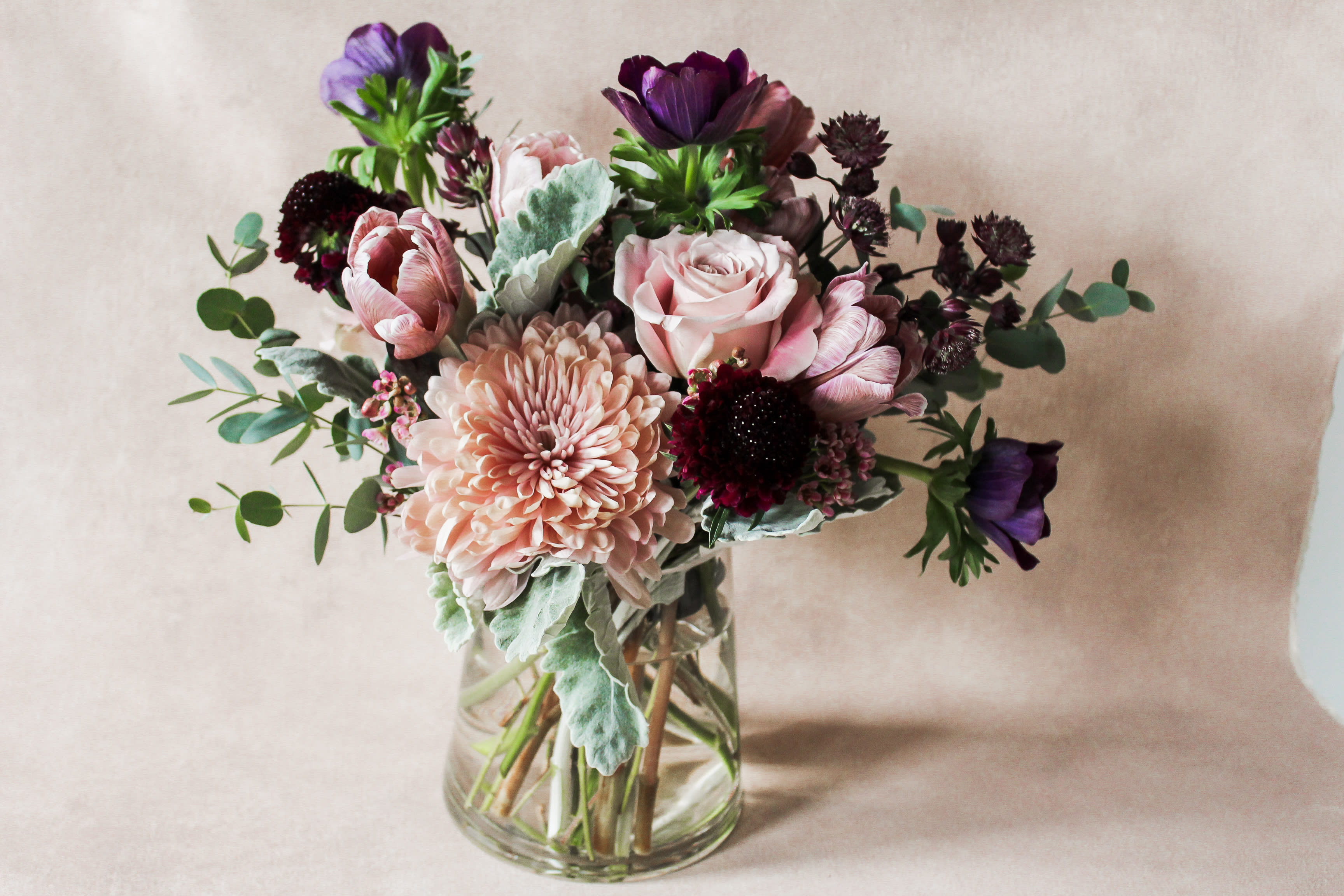 Violet Crush Violet Crush - We have been crushing lately on all things Violet! This color palette is full of rich, dark and light tones sure to make a lasting impression. As the days go by you'll be able to watch the tinted tulips dance above the arrangement in the sunlight.