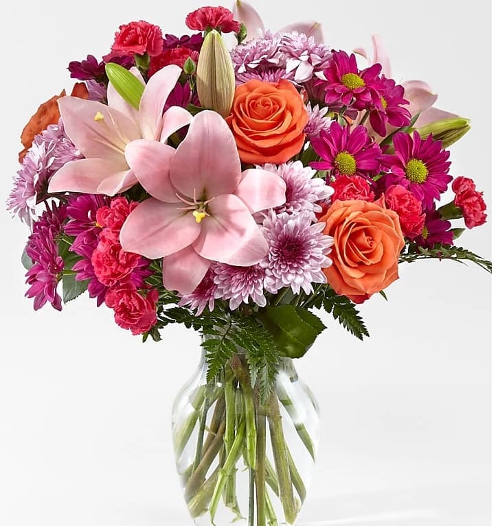 Lovely Day Bouquet - with this blissful bouquet of roses and lilies, hand-delivered in a classic glass vase. It's an impressive gift that promises to put some pink in her cheeks!