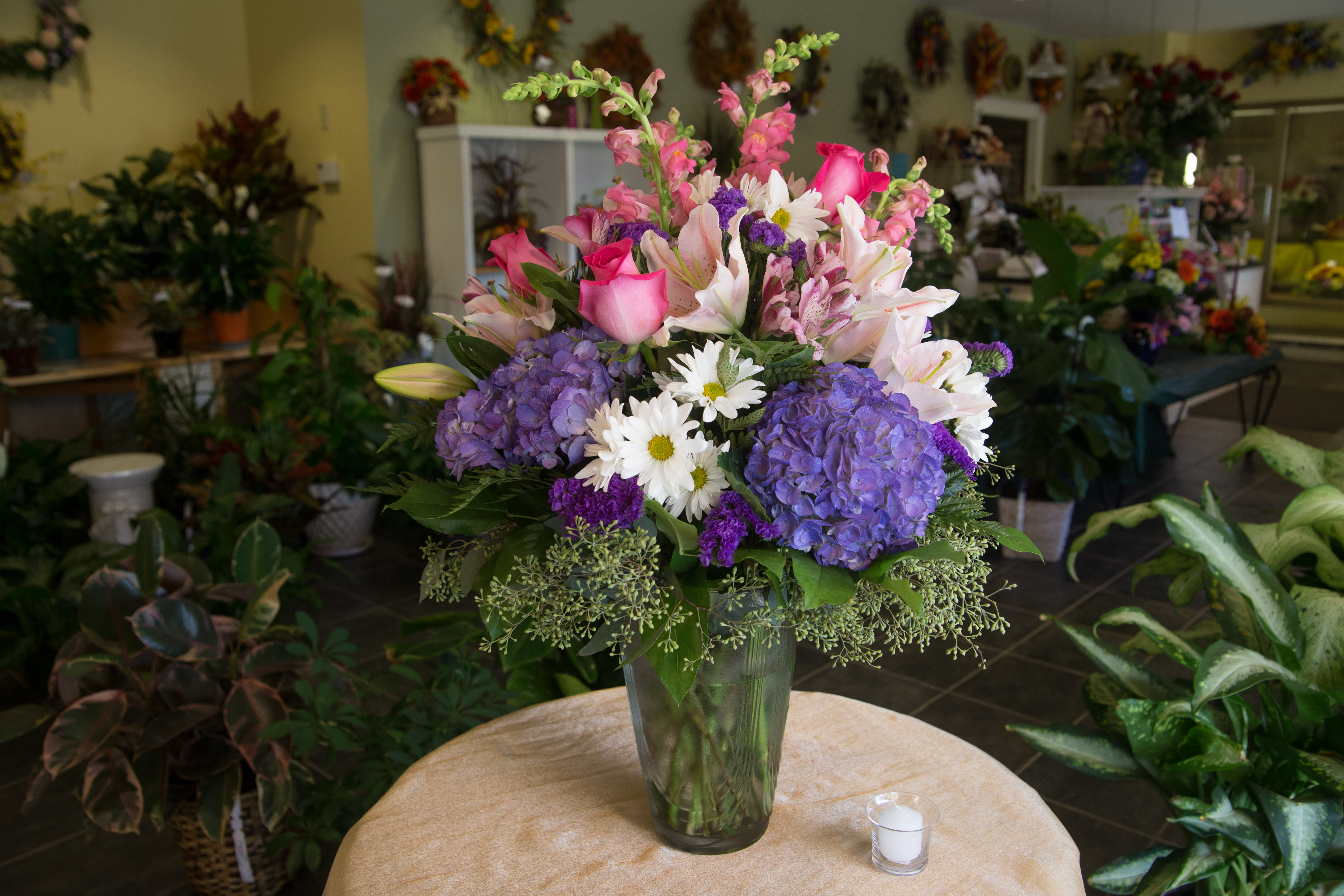 Elegance Abound - Send the Bouquet that makes a Statement. Includes pink lilies, lavender hydrangeas, hot pink roses and other beautiful flowers, perfect for any occasion.
