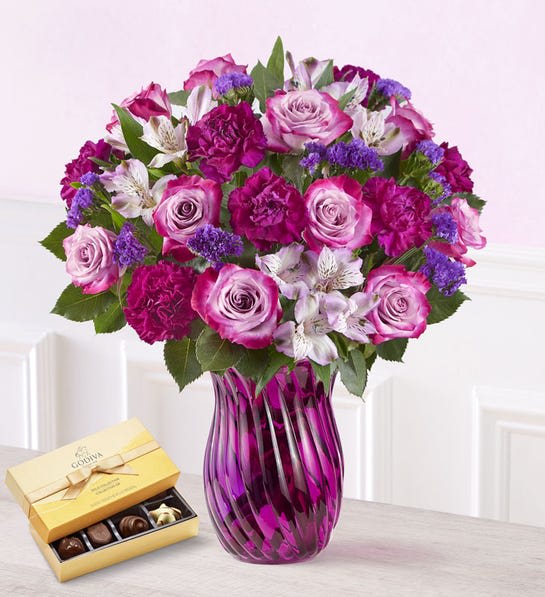 Valentine Splendor - A Valentine’s surprise full of splendor. Our mixed bouquet of farm-fresh blooms in shades of purple reigns supreme on the most romantic day of the year.  Mixed bouquet of purple roses, purple carnations, purple statice and lavender Peruvian lilies (alstroemeria) Picked fresh on our premier farms around the world, our flowers are cared for every step of the way and shipped fresh to ensure lasting beauty and enjoyment