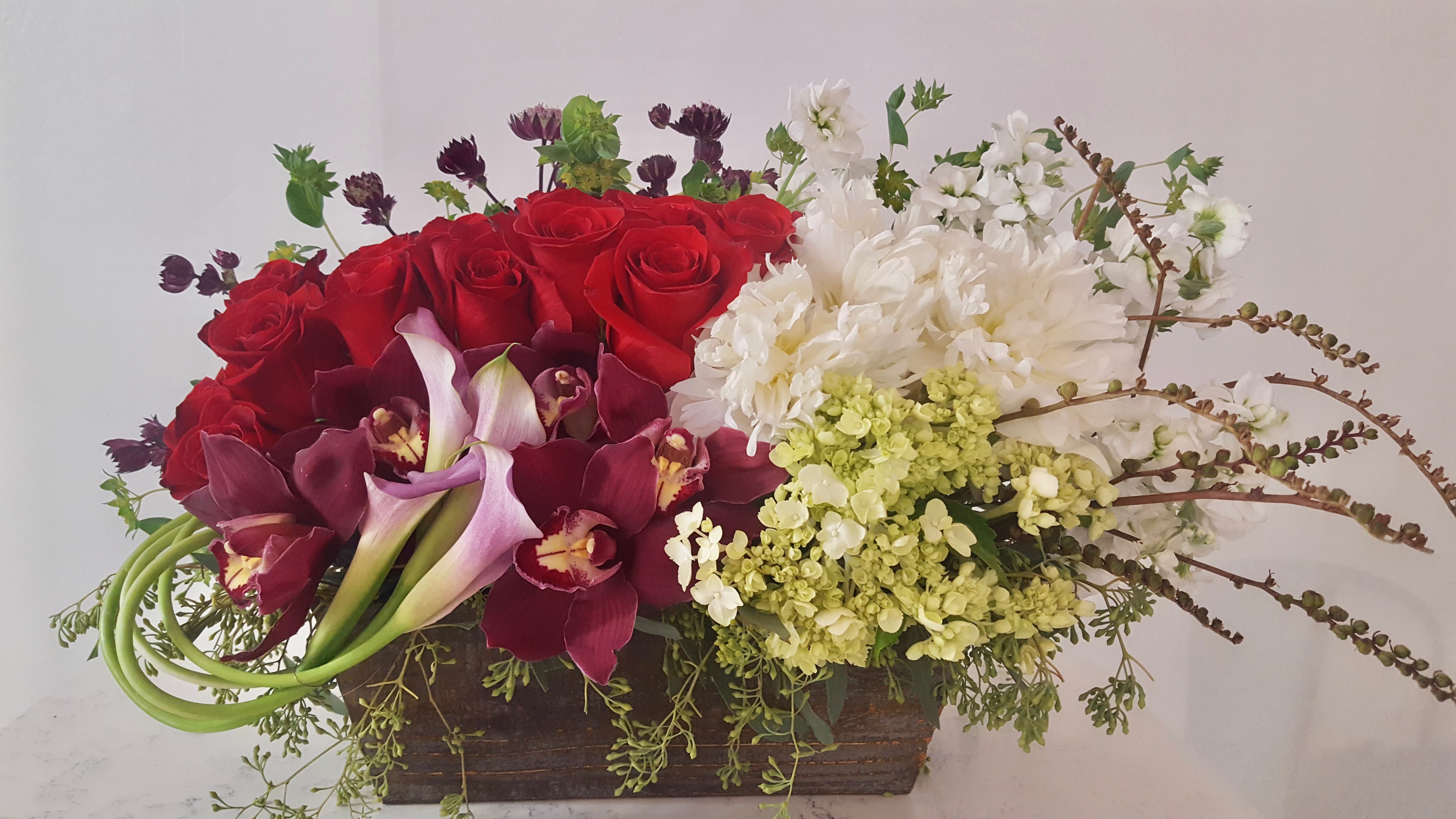 Caring Heart Caring Heart - Composed of orchids, roses, peonies, stock, acacia, hydrangeas.