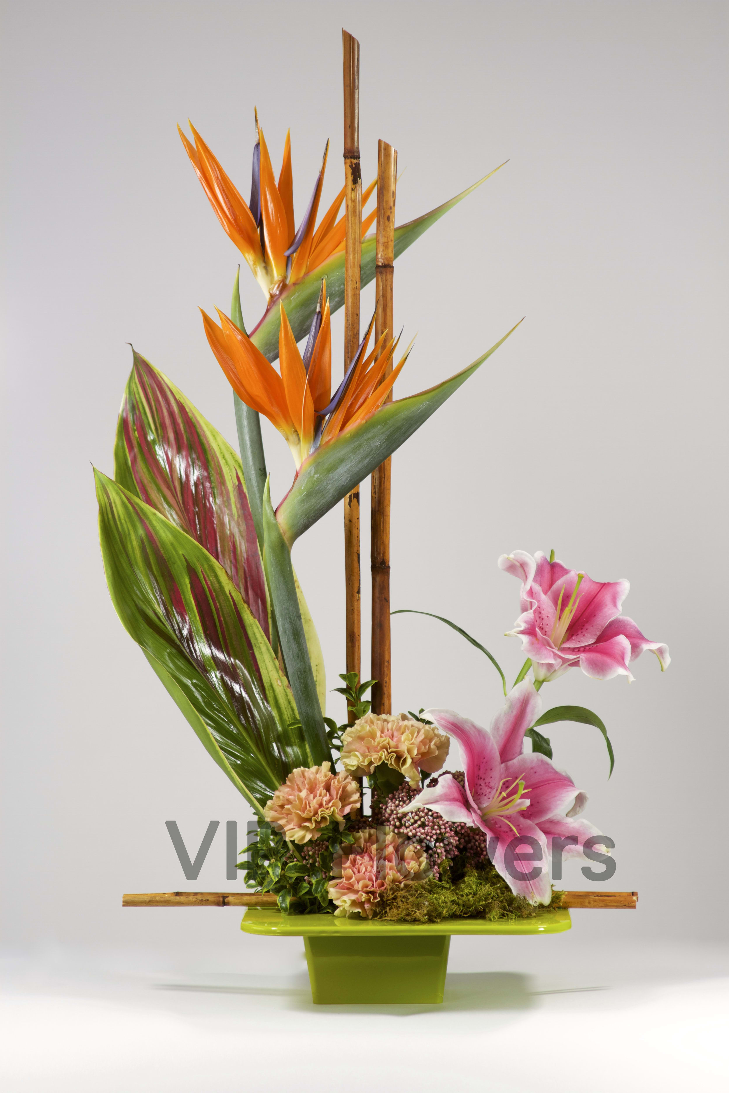 Simply Exotic - Flowers Included:  Birds of Paradise Lilies Carnations Bamboo Seasonal Flowers Seasonal Greens       Substitutions may be necessary to ensure your arrangement or specialty gift is delivered in a timely manner. The utmost care and attention is given to your order to ensure that it is as similar as possible to the requested item (Please note that some flowers and colors may vary due to seasonality.)
