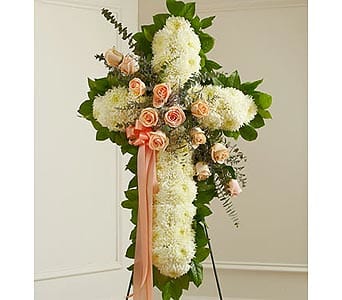 White Cross with Peach Rose Break White Cross with Peach Rose Break - Send a white floral cross with elegant peach roses to a family who has recently suffered the loss of a loved one. This sympathy standing spray with appropriate funeral flowers makes a thoughtful choice for any funeral service and will honor the life and faith of the deceased. As Shown : HUD-91197