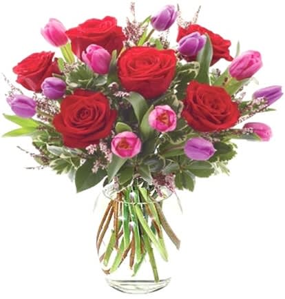 Elegant Love Bouquet - Sparks flew when you met her. Recapture that moment by sending this passionate, hand-designed arrangement of red roses with purple and pink tulips