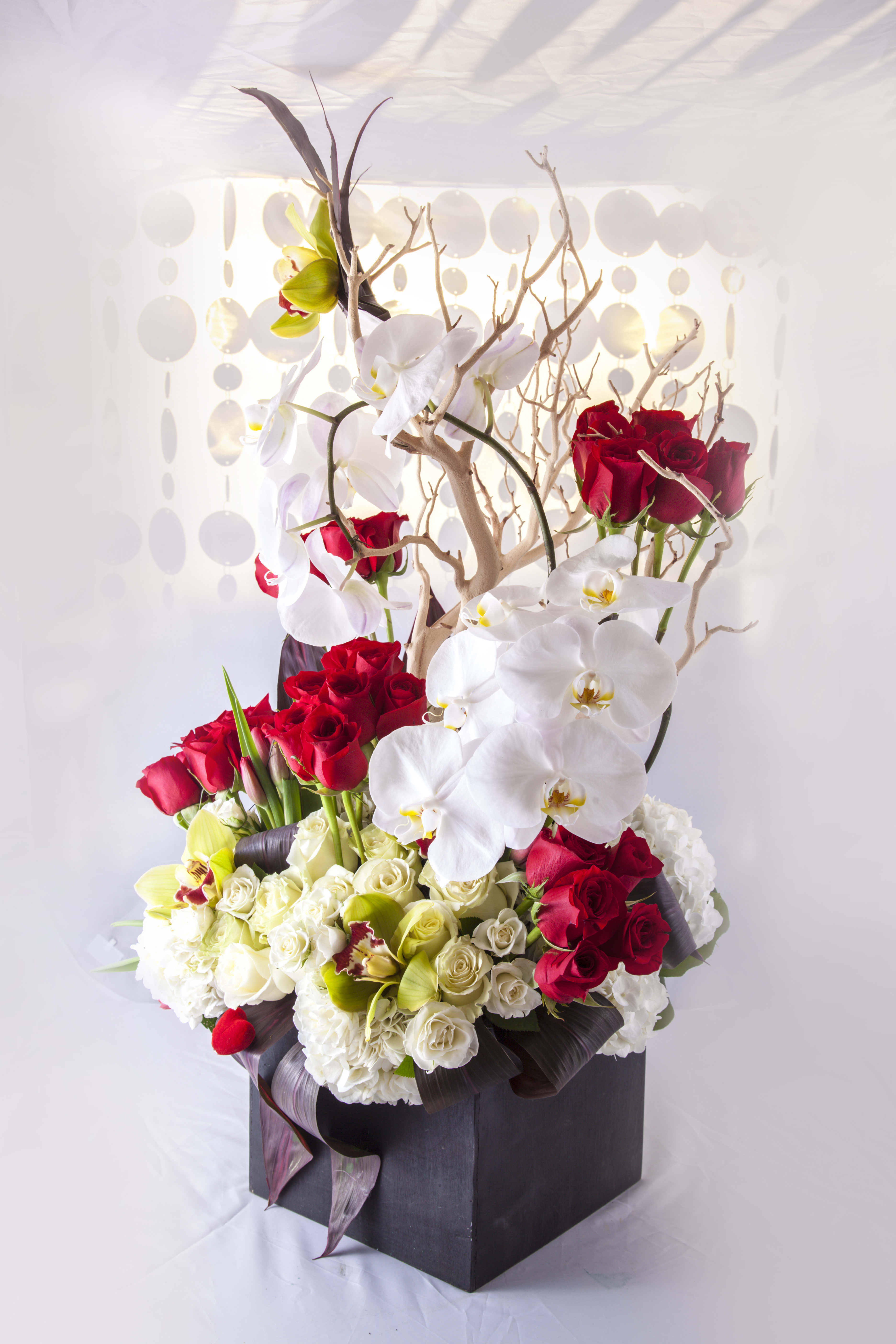 Blooms in Red and White Blooms in Red and White - Assortment of roses, orhchids, and hydrangeas.
