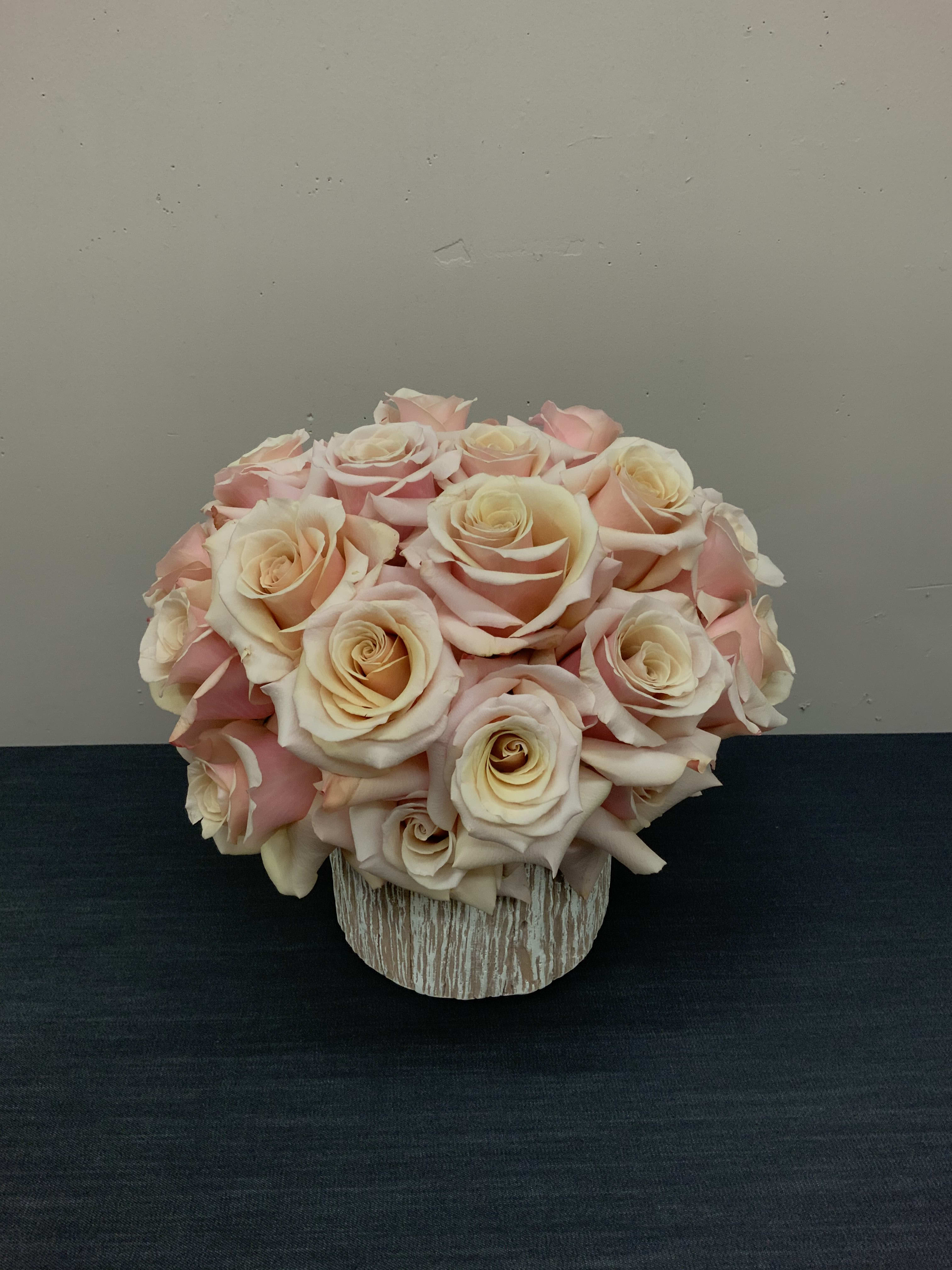 Perla - Simple and elegant an arrangement with two dozen roses.