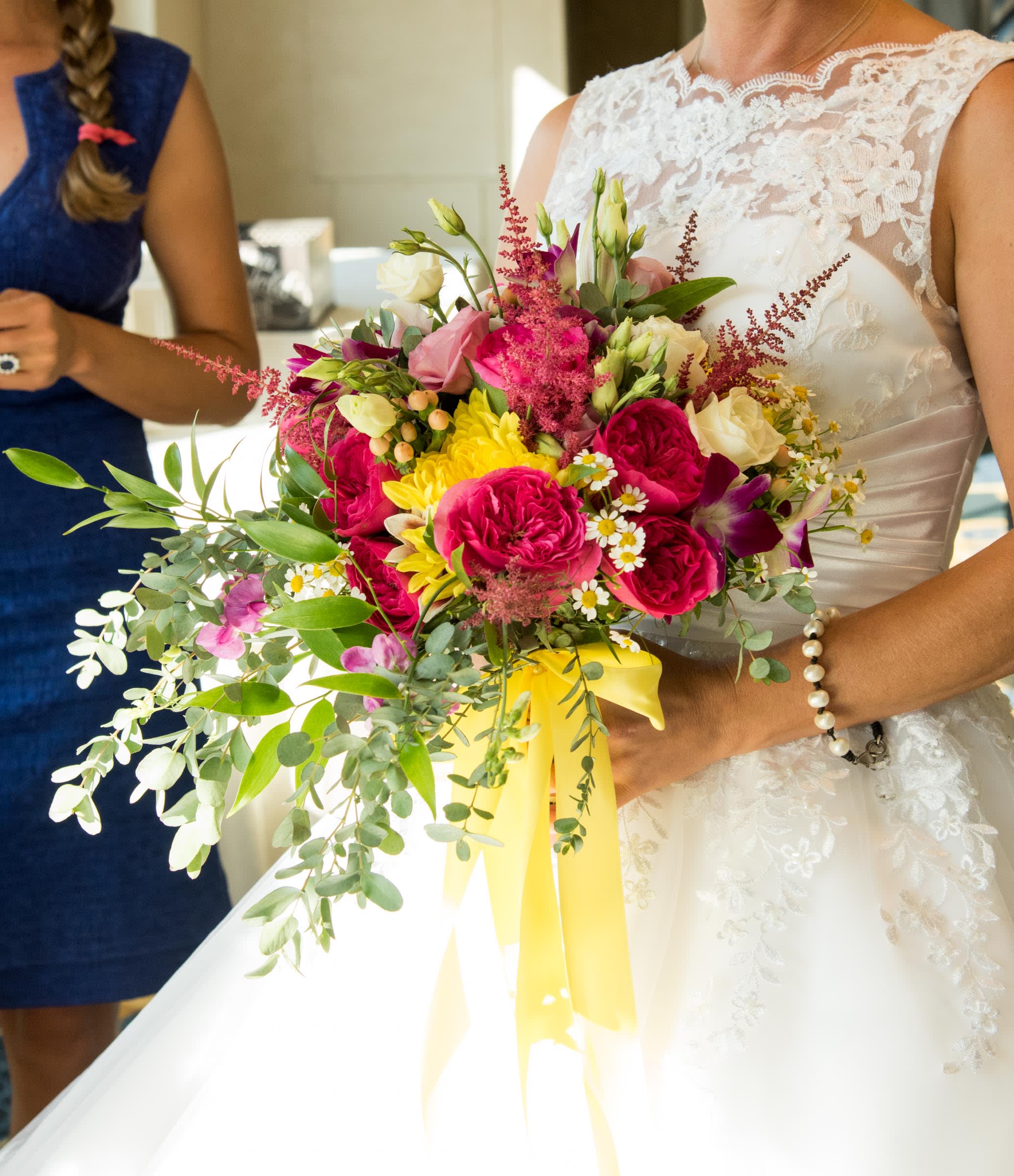 The Dazzling Bridal Bouquet - Pink Floyd Roses, Astilbe, Yellow Cremone, Fever Few Daisies, Baronesse Garden Roses accompanied by assorted eucalyptus create this gorgeous bridal bouquet hand tied with canary yellow ribbon.  Call us or email us directly to schedule your consultation. 
