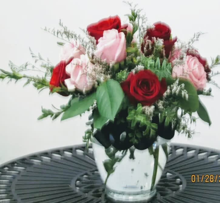 Bashful - red and pink roses with a assorted greenery 