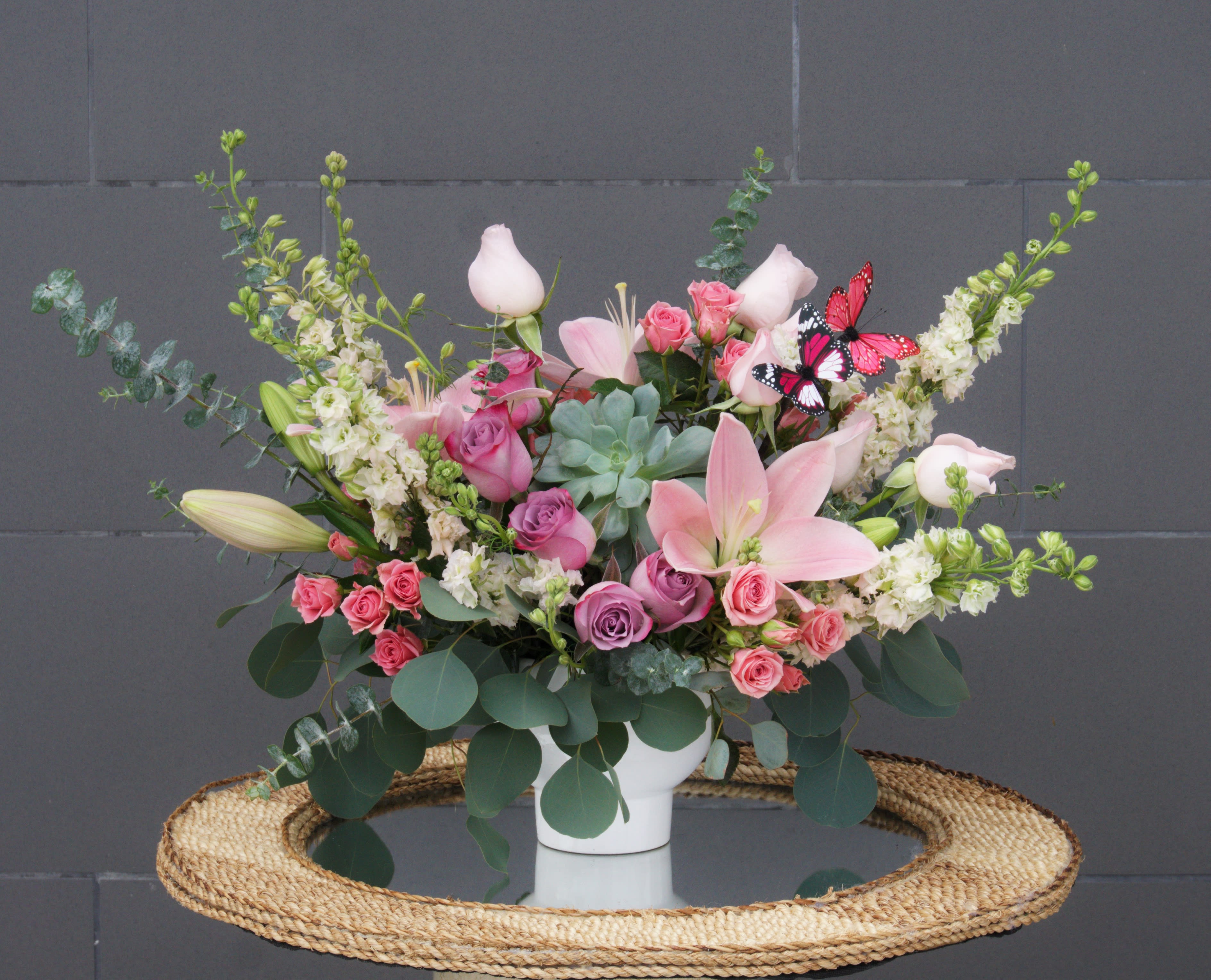 Sweet Pink - Lovely pink blooms including lily, rose, larkspur, succulent... and accents.