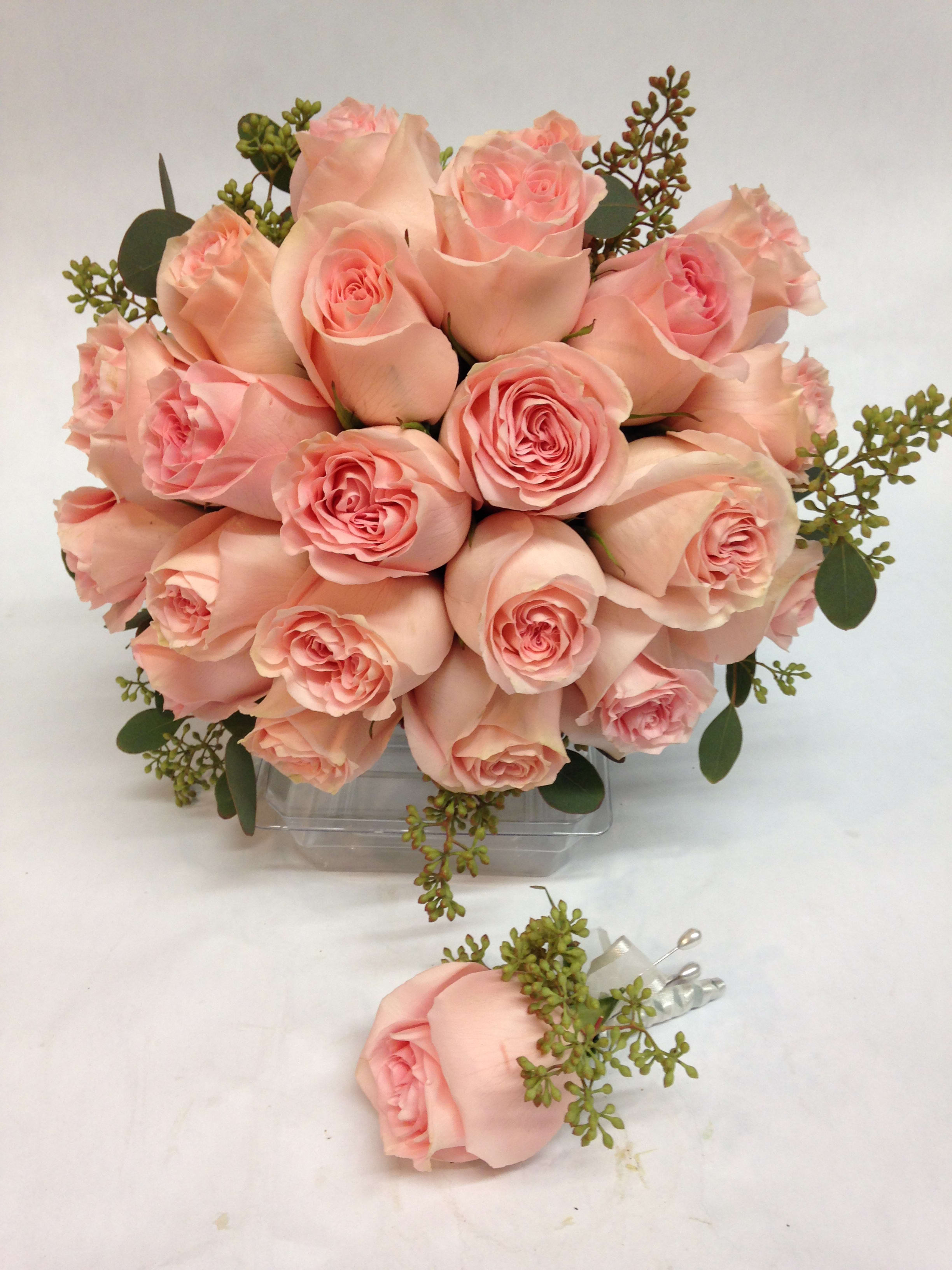 Rosey and Radiant Bridal Bouquet Rosey and Radiant Bridal Bouquet - This classically gorgeous bouquet of blush roses will radiate beauty on your special day! The blooms are surrounded by seeded eucalyptus. A matching boutonier is included. Featured Bouquet and Boutonier: $200.00 (Regular Price)