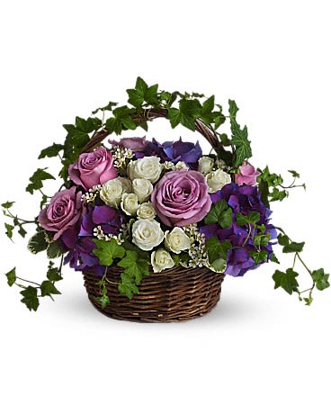 A Full Life - Even in mourning it is important to remember and honor a life well lived. This beautiful basket of purple and white flowers blended with vibrant greenery is a wonderful way to pay tribute to one who has indeed lived a full life.  Brilliant flowers such as purple hydrangea, lavender roses, white spray roses and waxflower are arranged with beautiful ivy and more in a lovely round basket.      Orientation: All-Around      All prices in USD ($)      Standard      T211-1A      Standard      T211-1B      Premium      T211-1C 
