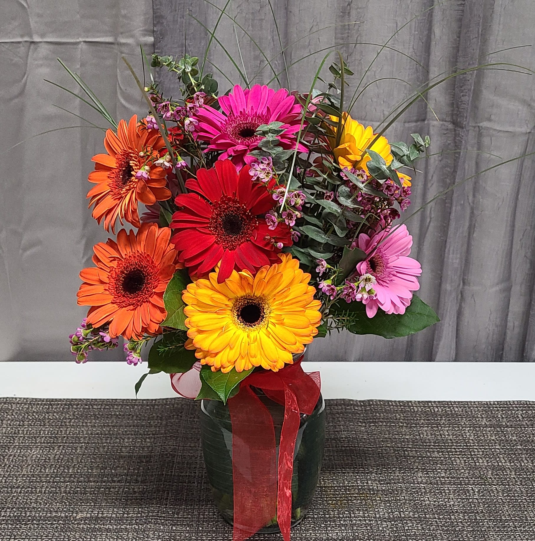 Daisies a plenty  - Colorful gerbera daisies with beautiful green filler