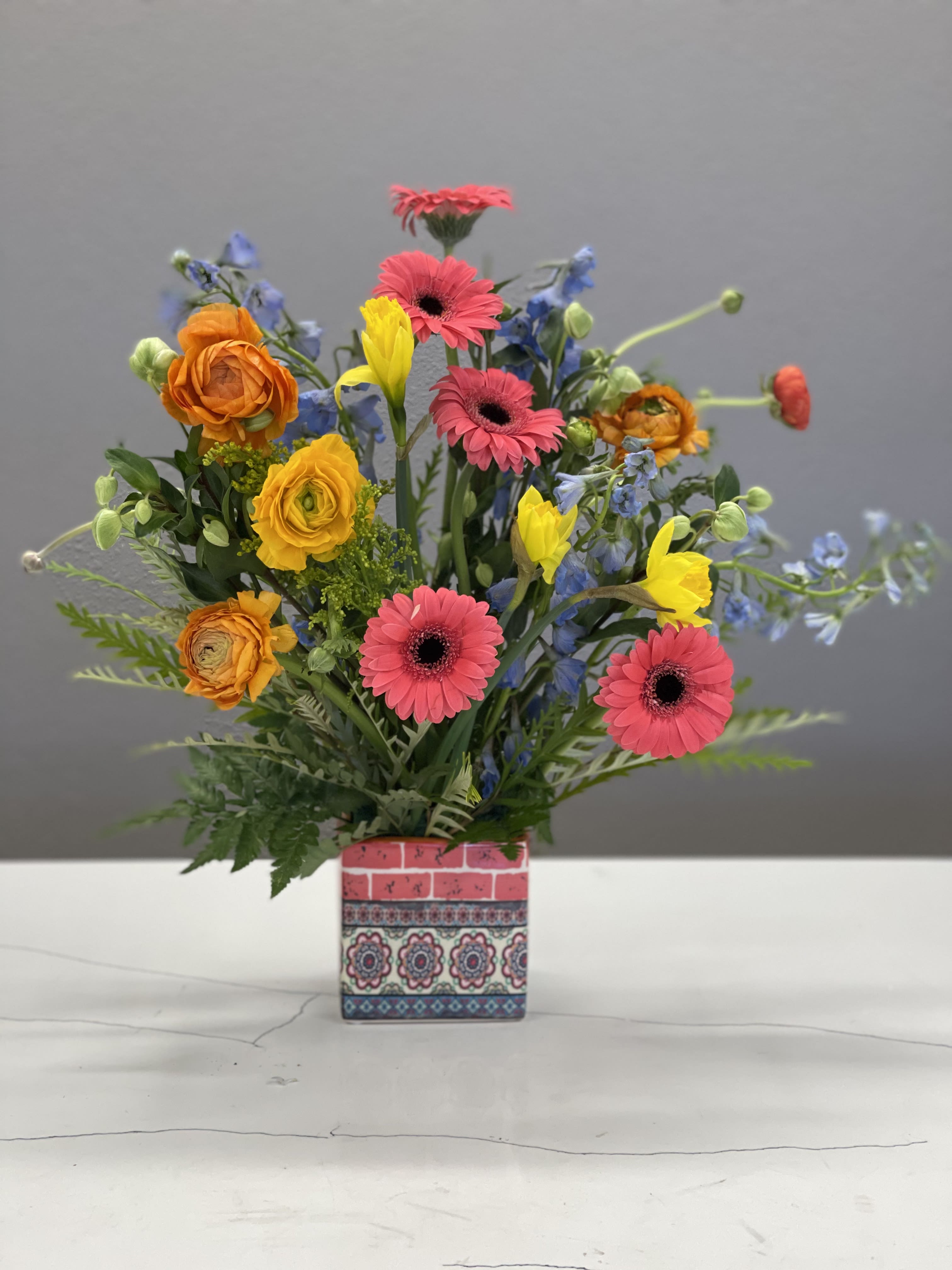 Nature's Mosaic  - Colorful blooms busting out of this cute little container is the perfect way to celebrate your loved one, send a hug, or treat yourself! 