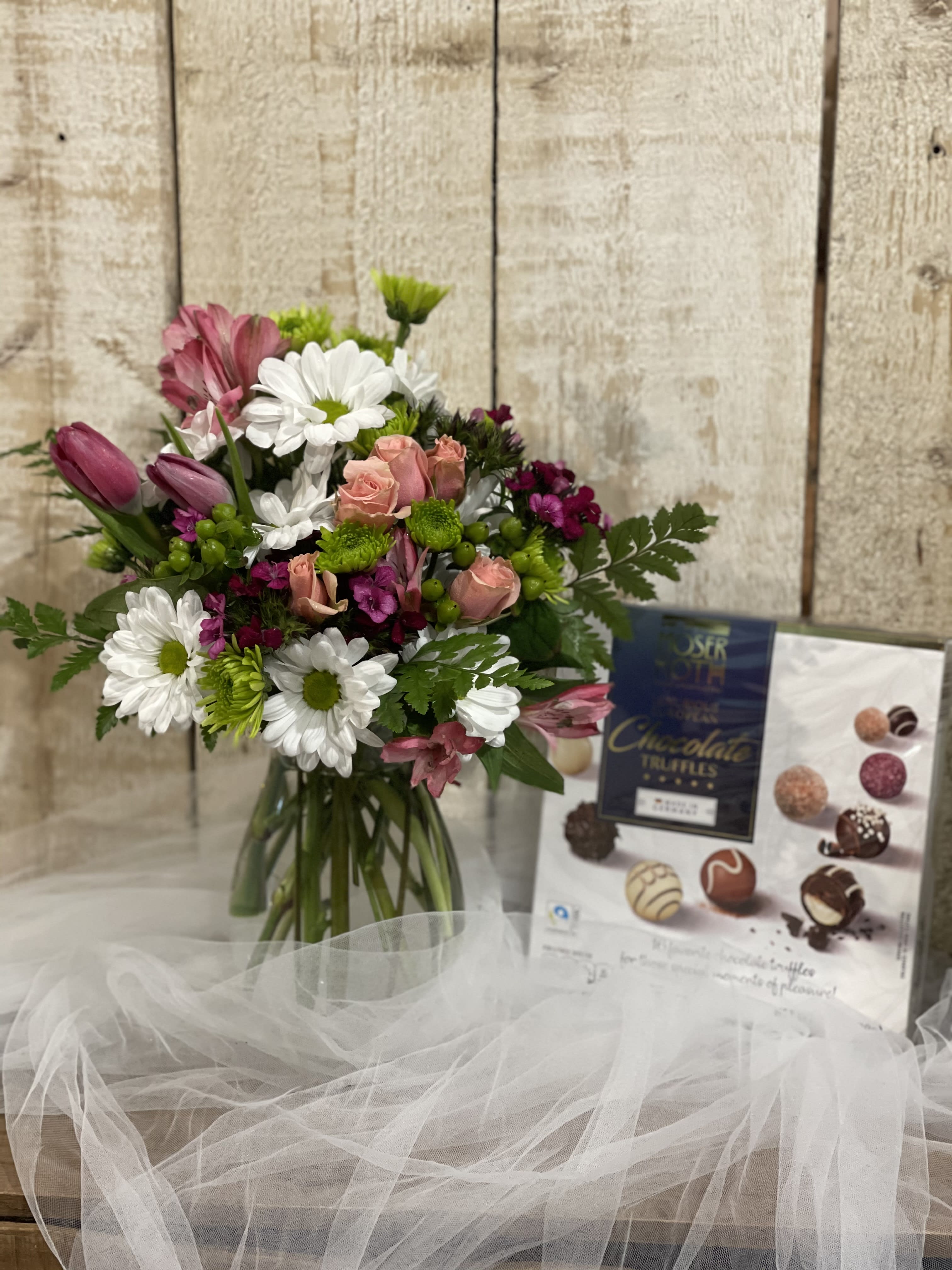 Truffles &amp; Tulips - A sweet and savory combination perfect for any occasion!  A designer's choice arrangement and a large box of delicious chocolates is included.  Please note the bouquet and color will vary based on seasonal flower availability.