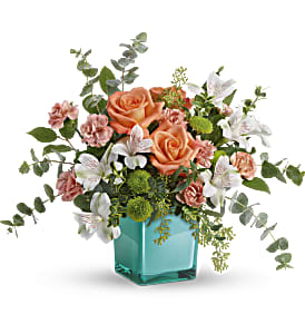 Teleflora's Sunset Splash Bouquet - Inspired by the warm peach skies and crystal blue waters of a tropical sunset, this fun-filled rose bouquet adds a splash of happiness to any occasion!