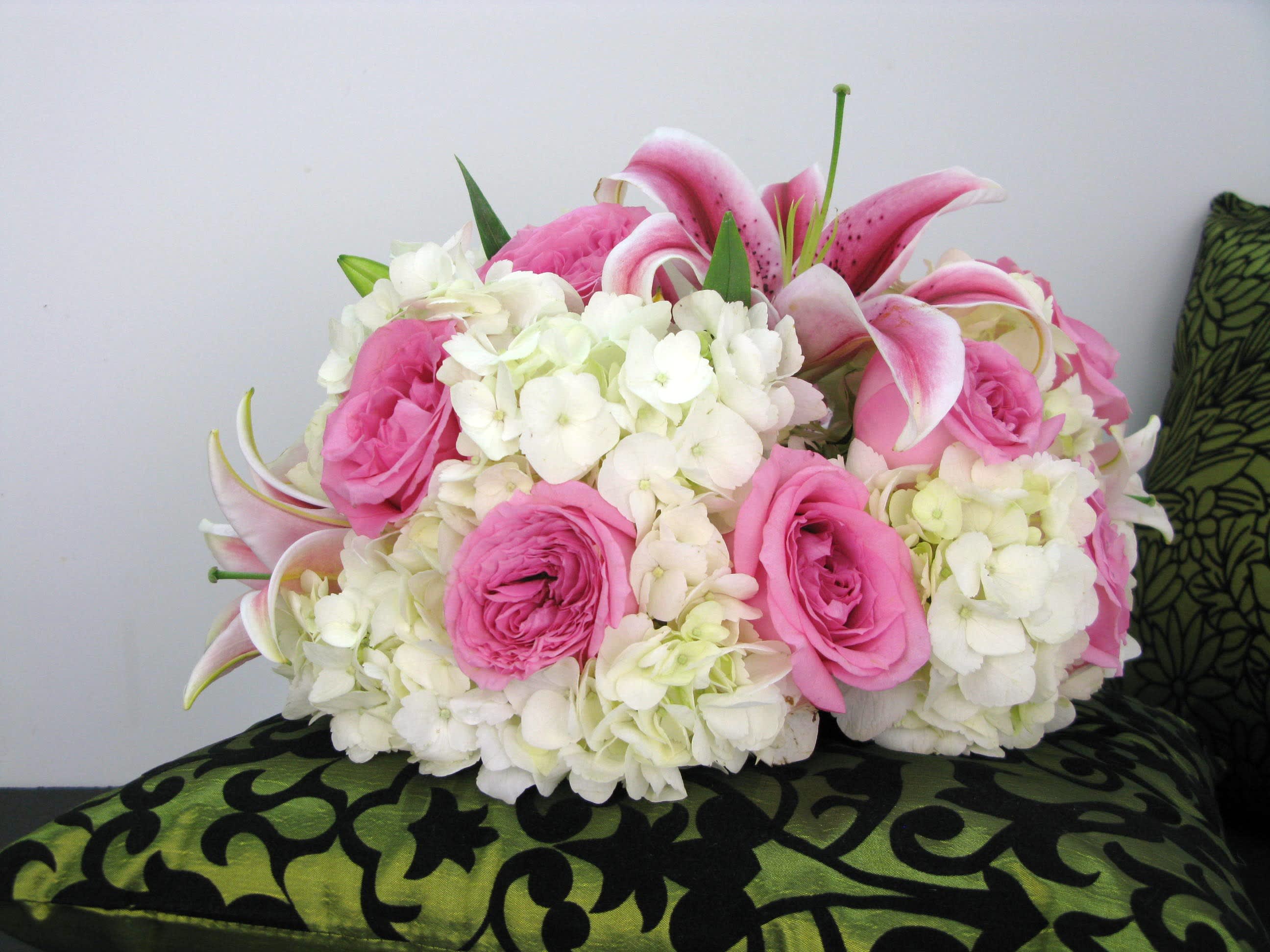 Unforgettable Unforgettable - Precious pink roses and lilies mixed with white hydrangeas, will make a new mom fell the joy for her baby girl. Flowers and similar colors