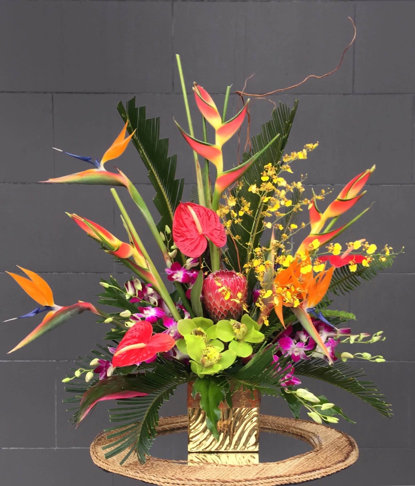 Tropical Luxe - Beautiful design including long-lasting tropical flowers and accents in a nice vase.